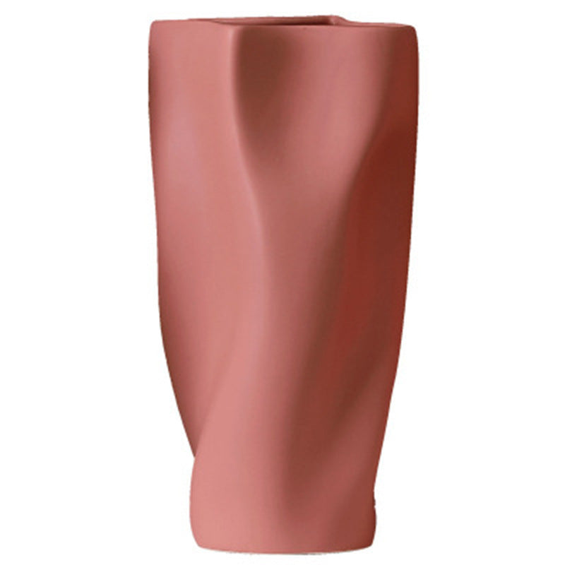 Creative modern porcelain vase in bean paste powder color with twisted design