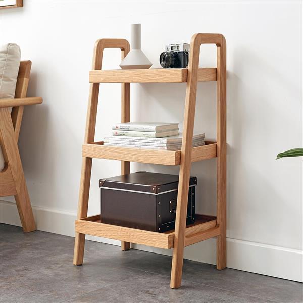 Three-tier natural wood storage shelves with books and decor in modern living room