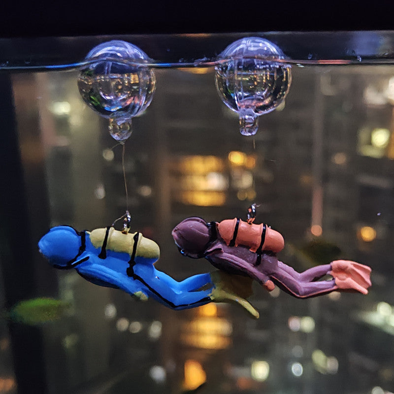 Resin floating decoration scuba diver figurines in aquarium attached to glass with suction cups